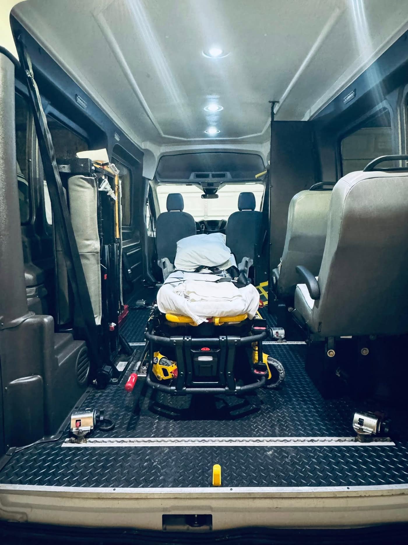 Medical stretcher secured inside ATS van interior