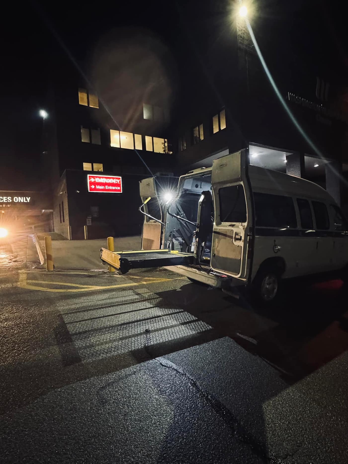 ATS van at hospital entrance at night